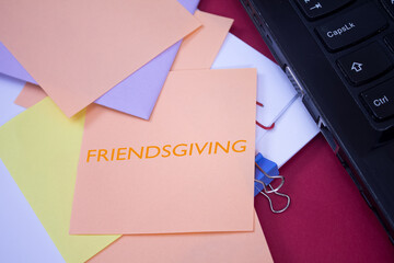Poster - Friendsgiving. Text on adhesive note paper. Event, celebration reminder message.