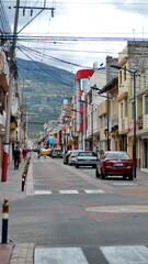 Naklejka na meble Cars parked along a nearly empty road in Cotacachi, Ecuador, during the COVID-19 lock-downs of 2020
