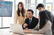 © ronnachaipark - Office colleagues having casual discussion during meeting in the conference rooms, Business and office concept, the business team with laptop computers and documents
