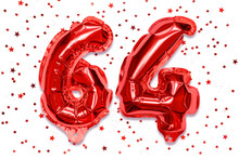 The Number Of The Balloon Made Of Red Foil, The Number Sixty Four On A White Background With Sequins. Birthday Greeting Card With Inscription 64. Numerical Digit. Celebration Event.