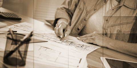 Wall Mural - Female architect working on sketch, geometric pattern