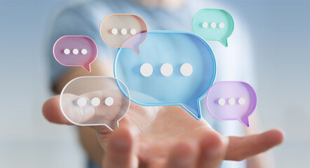 Wall Mural - Businessman using digital speech bubbles talk icons. Minimal conversation or social media messages floating over user hand. 3D rendering