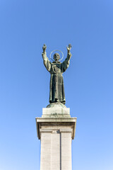 Wall Mural - Bronze monument to St Francis of Assisi in Risorgimento Square, built in early 20th century, Milan, Lombardy region, Italy