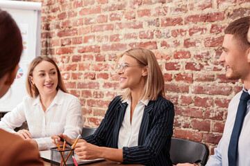 Poster - Businesswoman having meeting with her employees in office. Lady boss