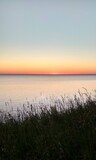 Fototapeta Sawanna - sunset over the sea