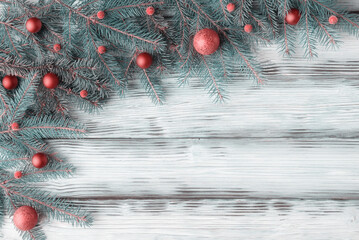 Wall Mural - Christmas decoration and fir tree branches on aged wooden background with copy space. Christmas and New Year concept