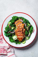 Canvas Print - Grilled chicken salad with kale, cucumber, radish and onion. Healthy protein food, low carb diet.