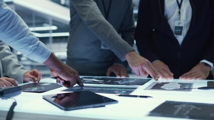 Fototapete - Executive Office Meeting of Chief Engineers Discussing Important Data Points of Their Latest Industrial Manufacturing Production of New Equipment. Managers DIscussing Blueprints on a Table.
