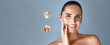 Beauty portrait of a senior woman applying cream on her skin. Close ups showing skin problems, weinkles  and imperfections. Web banner with a copy space