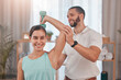 © Beaunitta V W/peopleimages.com - Physical therapy, smile and exercise for shoulder pain of a happy woman with a chiropractor employee. Arm workout weight lifting of a patient feeling relax after a chiropractic and dumbbell lifting