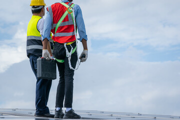 Aufkleber - Technician checking solar panels on factory roof,Environment friendly, Green energy,Ecological,Using natural renewable energy.