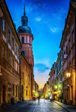 Warsaw Old Town Street. Evening View Of Old Houses And Church. Long Exposure. Warsaw, Poland.