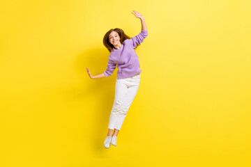 Canvas Print - Full length photo of overjoyed lady wear violet comfort clothes raise hand cool party holiday weekend isolated on yellow color background