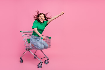 Wall Mural - Full body portrait of excited amazed lady raise arm empty space isolated on pink color background