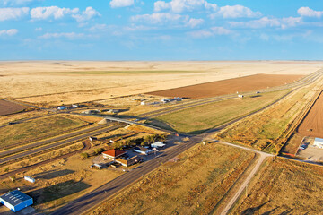 Canvas Print - Aerial view of Adrian Texas the Mid-point of Historic Route 66 during autumn.