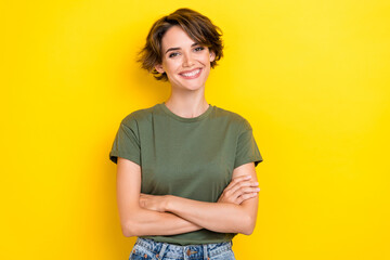 Sticker - Portrait of cute confident satisfied woman with bob hairdo dressed khaki t-shirt standing arms folded isolated on yellow color background