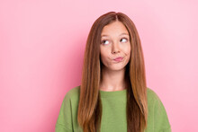 Photo Of Adorable Good Mood Thoughtful Girl With Straight Hairstyle Wear Green Pullover Look Empty Space Isolated On Pink Color Background