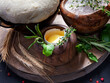 Pizza dough with egg, herbs and flour