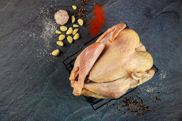 Wall Mural - Raw turkey should be spiced and garlic-infused before roasting.