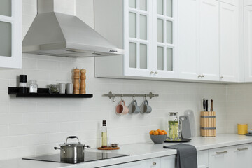 Canvas Print - Elegant kitchen interior with range hood and furniture