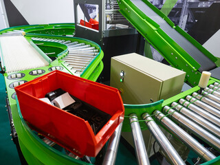 Poster - Production conveyor. Box moves along conveyor lines. Manufacturing process. Industrial technologies. Automated production without people. Conveyor operating in automatic mode. Factory, manufactory