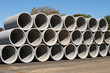 © Victor - Concrete round big pipes stacked outdoors sewer large heavy