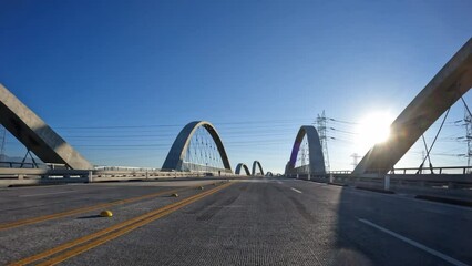 Wall Mural - Early morning driving view crossing the new 6th Street Bridge near downtown Los Angeles in Southern California.