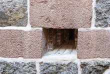 Bird Deterrent In Opening In Stone Castle Wall
