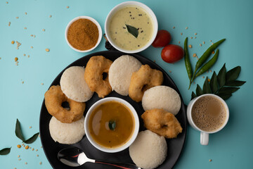 Wall Mural - south indian food called idli vada sambar or sambar vada or wada, served with coconut chutney and south indian style hot coffee