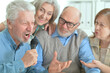 © aletia2011 - two senior couples singing karaoke