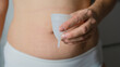 © Наталья Смирнова - The girl is holding a menstrual cup in her hands. Reusable feminine accessories for intimate hygiene. Feminine intimate hygiene products during the period.
