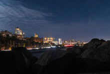 Towers, Modern Skyscrapers, City Buildings At Night, Lights. Right Bank Of The Dnieper. Beautiful Night City By The River. Panoramic Night View.
