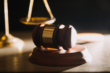 Business and lawyers discussing contract papers with brass scale on desk in office. Law, legal services, advice, justice and law concept picture with film grain effect