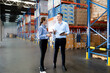 © Nassorn - Distribution warehouse manager and client businesswoman using digital tablet checking inventory storage on shelf. Storehouse supervisor worker and logistic engineer standing together at storage room.