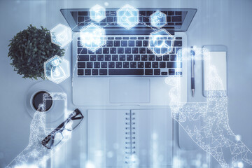 Poster - Technology hologram drawing over computer on the desktop background. Top view. Double exposure. Tech concept.
