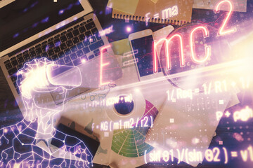 Poster - Physics and math theme hologram with formula drawings over computer on the desktop background. Top view. Multi exposure. Concept of education.