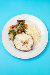 Sticker - baked vegetables with boiled fish on white plate