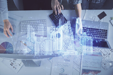 Poster - Double exposure of man and woman working together and buildings hologram drawing. Smart-city concept. Computer background.