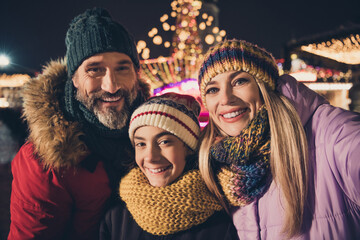 Poster - Self-portrait of attractive affecionate adorable cheerful family wife husband three people visiting festal fair strolling city urban outdoors