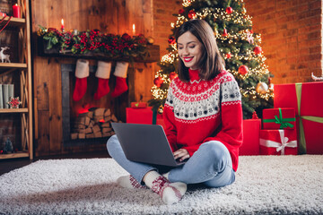 Sticker - Full length portrait of attractive cheerful person sit carpet floor crossed legs use netbook online shop order house indoors