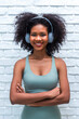 © kanpisut - Portrait of African American woman with bushy curly hairstyle
