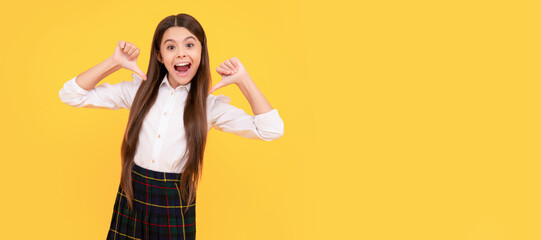 Canvas Print - happy teen girl in school uniform full length pointing fingers on herself, happiness. Child face, horizontal poster, teenager girl isolated portrait, banner with copy space.