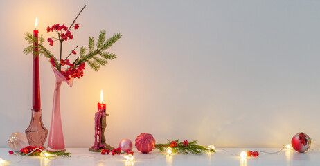 Wall Mural - pink christmas decor with burning candles in white interior