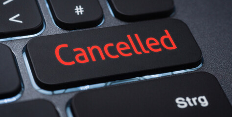 Wall Mural - illuminated keyboard with a labeled key - cancelled