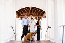 Portrait Of Fashion Family With Their Dog By Colonnades