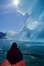 Kayaker In Front Of Glacier, Alaska.