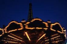 Carousel Lights At Dusk With Eiffel Tower In Background, Paris, France (blur).