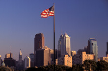 American Flag Infront Of Downtown Philadelphia, Pennsylvania, USA
