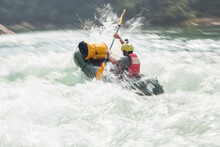 Man Paddling His Raft Down Rapid River On The Nam Ou River, Laos