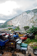 Trucks Used To Haul Mined Sand Sit In Front Of A Destroyed Mountain In Carrefour La Boule, South Of Port-au-Prince, Haiti.
